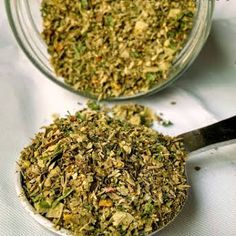 two glass bowls filled with different types of herbs