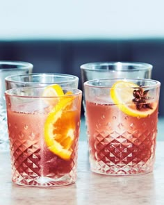 three glasses filled with different types of drinks