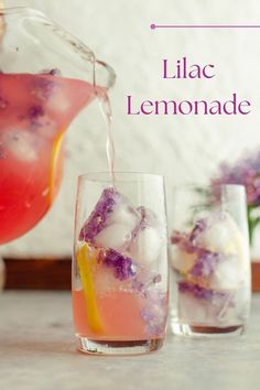 a pitcher pouring lemonade into two glasses filled with ice