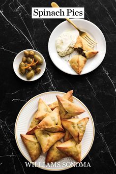 the cover of spinach pies by william sonoma, featuring olives and pita bread