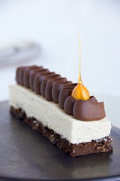 a piece of cake with chocolate and caramel on top