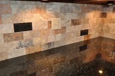 an image of a kitchen counter top that is made out of granite and has lights on it