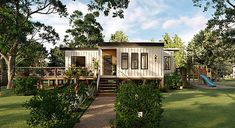 a tiny house in the middle of some trees with a slide and play area behind it