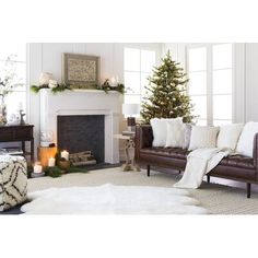 a living room filled with furniture and a christmas tree