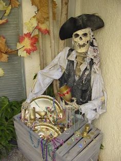 a skeleton sitting on top of a wooden crate