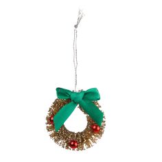 a christmas wreath ornament hanging from a string