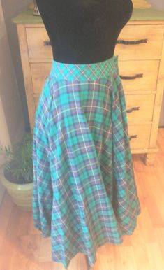 This is a darling vintage Liz Claiborne 1990s circle skirt.  The fabric is so soft and fun!  It is a very lightweight flannel cotton.  It would be a dream to wear- light but warm.  I love the colors: blue and green with a little yellow in a fun plaid design. The skirt has pockets!  Very handy.  It has a waist band and closes with 2 buttons.  The skirt is so full and fun!  I wish it fit me because I just want to go walking in it.  This seems like a perfect skirt for fall, winter and into early sp Vintage Liz Claiborne, Skirt Pockets, Plaid Design, Circle Skirt, Green Sweater, Cotton Flannel, Plaid Flannel, Waist Band, Liz Claiborne