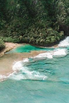 an aerial view of the ocean and beach