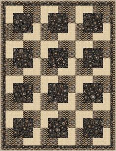 a black and white quilt with an intricate design on the front, in shades of beige