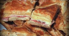 a pile of pastries sitting on top of a white plate