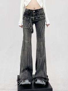 Infuse your wardrobe with a dash of rebellion with our Layered-Effect Denim Flare-Leg Jeans, complete with a grommet belt detail for that extra edge. Crafted from premium denim, these jeans are characterized by their layered look and skinny yet flared silhouette, promising to deliver both comfort and attitude. The intricate grommet belt detail not only accentuates the waist but also adds a unique, punk-inspired aesthetic that sets these jeans apart from the ordinary. Elevate your casual daywear Punk Style Fitted Wide Leg Jeans, Trendy Mid-rise Belted Jeans, Fitted Punk Style Denim Jeans, Punk Style Bottoms With Belt For Spring, Edgy Spring Flare Jeans, Fitted Dark Wash Punk Jeans, Fitted Punk Jeans In Dark Wash, Punk Style Fitted Dark Wash Jeans, Punk Wide Leg Jeans