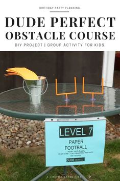 a table that has some sort of object on it with the words dude perfect obstacle course