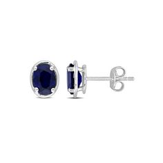 Add a versatile accessory to your collection with these solitaire stud earrings. Crafted in sleek sterling silver, these appealing earrings feature two oval-cut, prong set, lab-created blue sapphire gemstones (7x5mm) with a bezel style look. Polished to a brilliant shine, these classic earrings are secured with butterfly closures.If you do not like the hassle of changing your jewelry as per the occasion, then these elegant earrings are for you. Blue sapphires are the featured birthstone for the Rhodium Jewelry, Oval Stud Earrings, Diamond Birthstone, Solitaire Earrings, Silver Jewelry Earrings, Classic Earrings, Square Earrings Studs, Birthstone Earring, Diamond Hoop Earrings