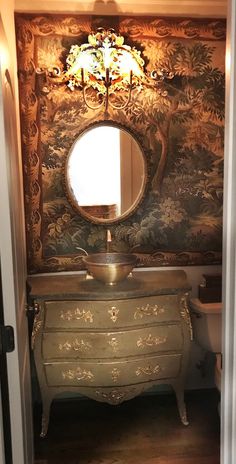 an antique dresser and mirror in a room