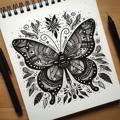 a black and white drawing of a butterfly with intricate designs on it's wings