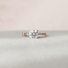 an engagement ring with three diamonds on it