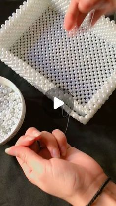 someone is making beaded trays out of plastic beads