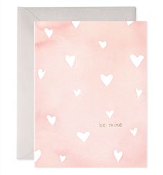 a pink card with white hearts on it and the words be mine written in gold