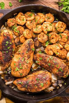 a skillet filled with cooked chicken and shrimp