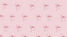 a pink background with bows on the top and bottom of them, all in different sizes