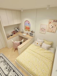 a small bedroom with a bed, desk and storage area in the corner between two walls