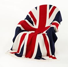 a red, white and blue blanket with the british flag on it's back