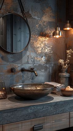 a bathroom with a sink, mirror and lights on the wall above it is shown