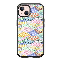 an iphone case with colorful flowers and dots on the back, in multicolored colors