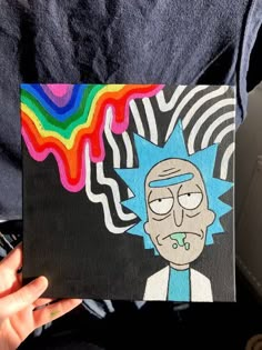 a person holding up a piece of art that looks like cartoon character rick from the simpsons