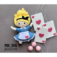 an image of a doll with hearts on her head and two tags attached to it