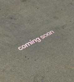 the word coming soon is painted on the ground