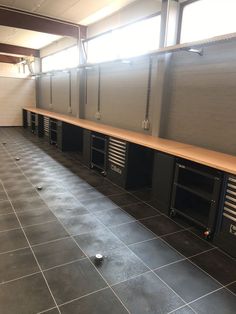 an empty room with many cabinets in it