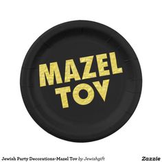 a black and yellow paper plate with the words mazel toy on it