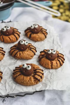 some cookies with googly eyes are on a table