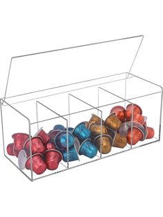 a metal container filled with lots of different colored balls