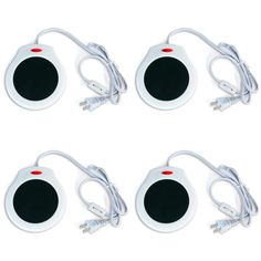 four white and black speakers with wires attached to them