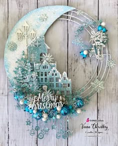 a blue and white christmas card with snowflakes on it