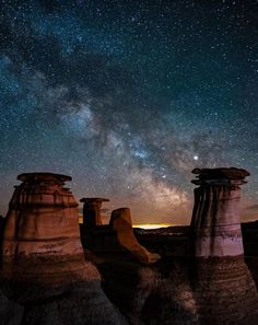 the stars shine brightly in the night sky above some rocks and rock formations at badlands national park, south australia