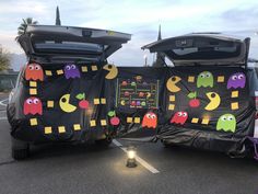 there are two cars that have been decorated with halloween decorations on the back and sides