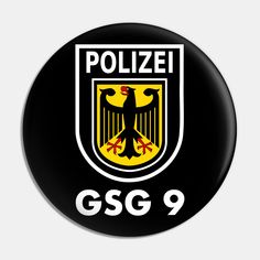 a black and yellow badge with the word polizei gsg 9 on it