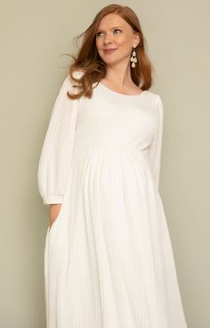 Feel fabulously feminine in our softly tailored and lightweight midi maternity dress in sheen ivory. Featuring a gently sheer pleated jersey, this maternity midi style is your go-to either for understated bridal chic, evening glamour or simply a relaxed vibe. You choose. Designed with a scooped neckline, cuffed sleeves, pleats across the empire line and a swishy skirt with concealed pockets for extra 'cool'. Soft sheen pleated jersey in ivory Scooped neckline front and back Bell sleeves finished Maternity Bridal Dress, Rose Tiffany, Maternity Occasion Dress, Lace Maternity Dress, Tiffany Rose, Pregnant Wedding Dress, Full Length Gowns, Party Kleidung, Silver Dress