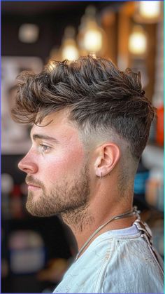 Dive into the edgy world of the Faux Hawk Fade showcased in our ultimate compilation of the best 27 fade haircuts and hairstyles for men. This modern twist on a classic look offers a bold statement that's both stylish and versatile, perfect for those who want to stand out from the crowd. For more trendsetting ideas and grooming tips, click to pin and follow us today! #FauxHawkFade #MensHairstyles #FadeHaircuts #Barbering #GroomingGoals Men’s High Fade Haircut, Mens Faux Hawk Fade, Edgy Haircuts Men, Edgy Mens Haircut, Fauxhawk Fade Men, Popular Haircuts For Men, Faux Hawk Men, Classic Mens Haircut, Low Taper Fade Haircut