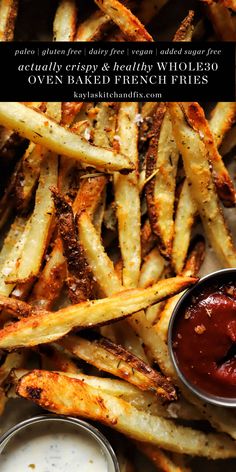 french fries with ketchup on the side and sauces in small bowls next to them