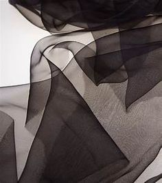 black sheer fabric blowing in the wind