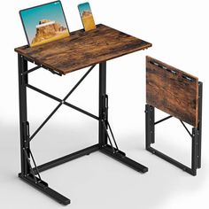 a computer desk with a laptop on top of it and a small wooden table next to it