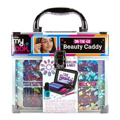 Get ready for beauty on the move with the My Look Makeup Caddy! This shimmering holographic clear case is packed with makeup essentials for eyes, lips, cheeks, and nails. Featuring three trending color palettes—blushing naturals, bold & bright, and pretty pastels—it includes real nail polishes, press-on fashion nails, nail art stickers, and sparkling gems, giving you everything you need to create stylish looks. Perfect for travel, the My Look Makeup Caddy comes with a convenient beauty storage t Makeup Caddy, Beauty Storage, Kids Watercolor, Tote Storage, Bright Hair, Activity Kits, Nail Studio, Glam Nails, Nail Art Stickers