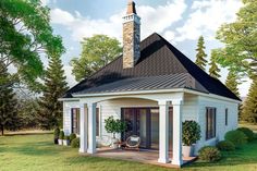 a small white house with a black roof and windows on the front porch is surrounded by greenery