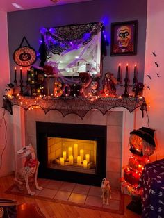 a living room decorated for halloween with candles and decorations