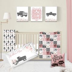 a baby's nursery with pink and gray decor, including crib bedding