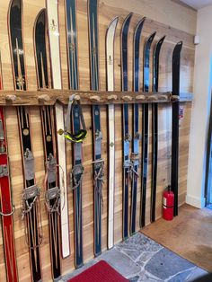 the skis are lined up against the wall and ready to be used as storage